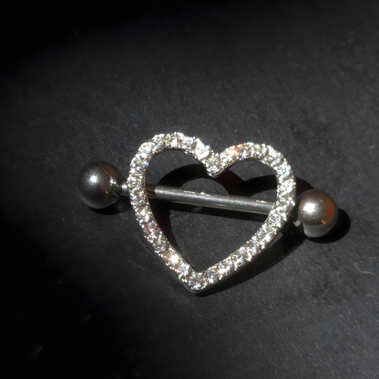Heart-shaped jewelry nipple shield with crystals on a dark background