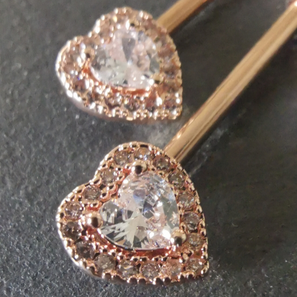 Elegant rose gold surgical steel heart nipple bar piercing with sparkling CZ, 14G body jewelry.