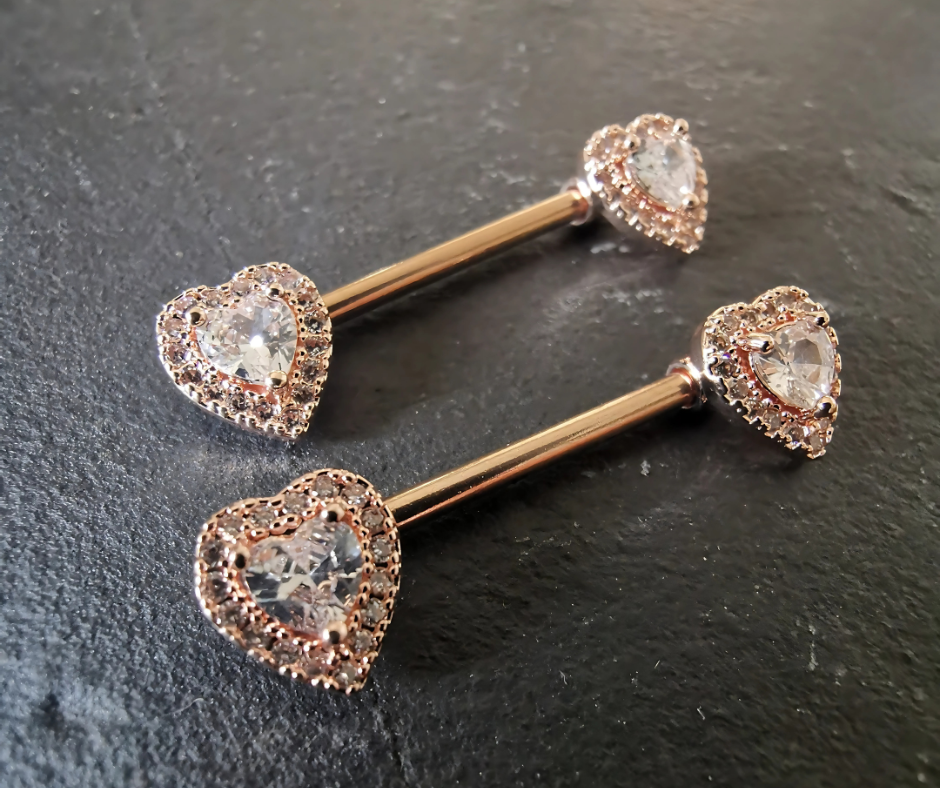 Heart nipple bar jewelry in rose gold with cubic zirconia, crafted from durable 14G surgical steel 316L.