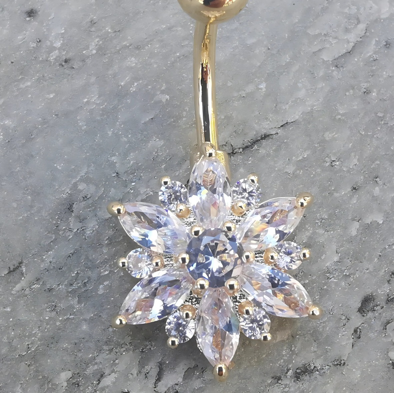 Hypoallergenic 316L stainless steel belly piercing jewelry in gold with a delicate white floral charm.