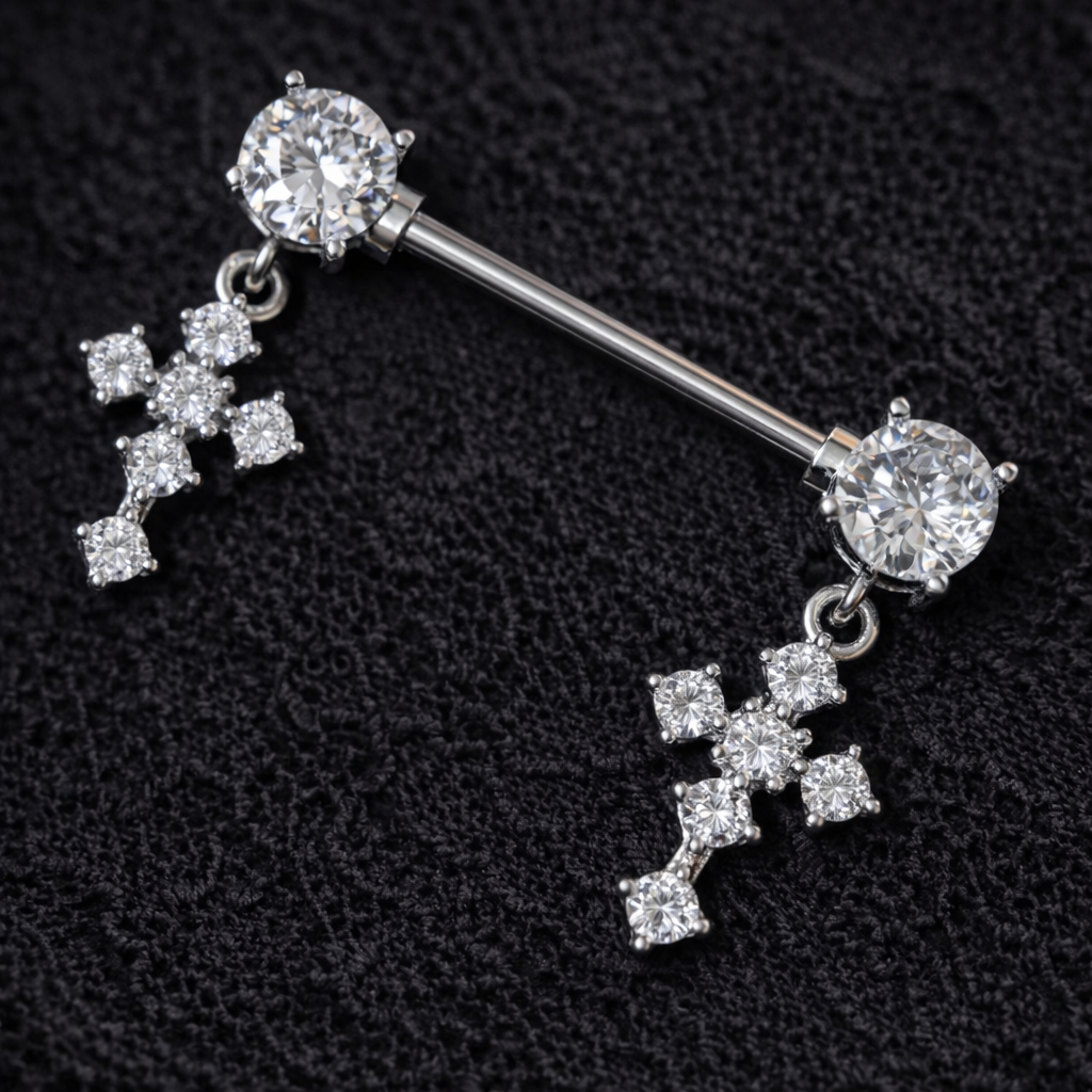 Nipple bars with cross-shaped pendants on a black textured background
