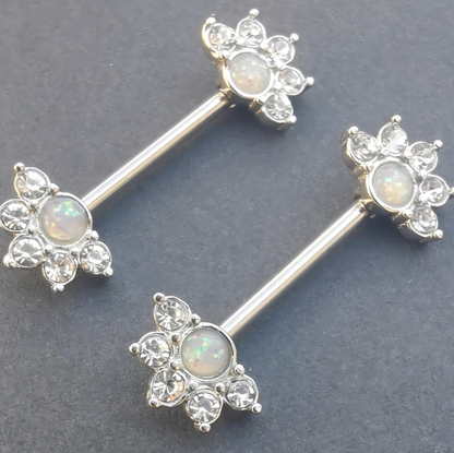 Hypoallergenic silver nipple piercing barbell in 14G with a mandala flower motif and bright opal inlay.