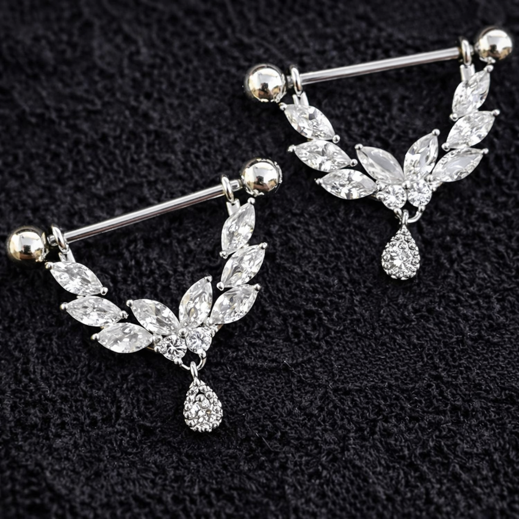 Pair of silver nipple dangle piercing bars on a black background