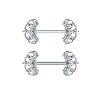 Pair of silver nipple rings with crown designs on a white background