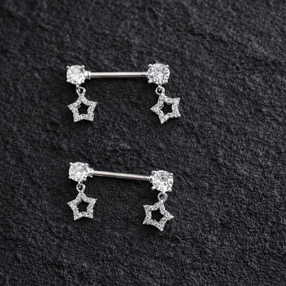 Pair of silver star-shaped nipple bars on a black textured background
