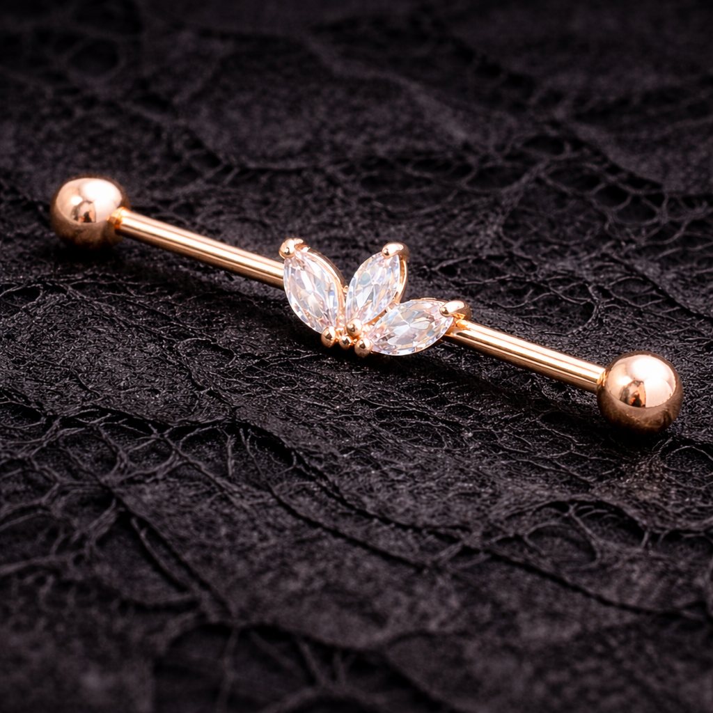 Rose gold industrial ear ring with butterfly design on a black textured background
