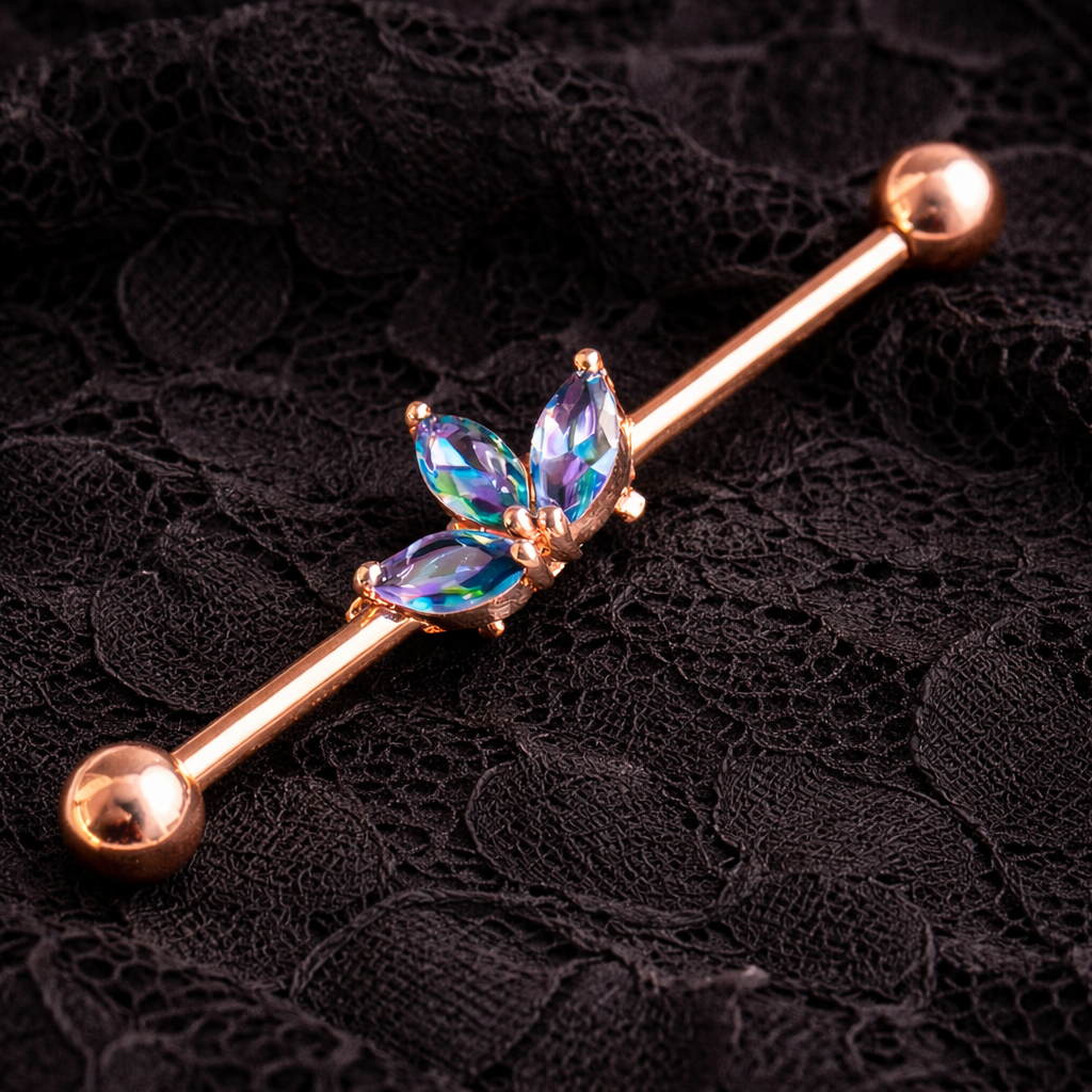 Rose gold ear ring with gemstones on a black lace background