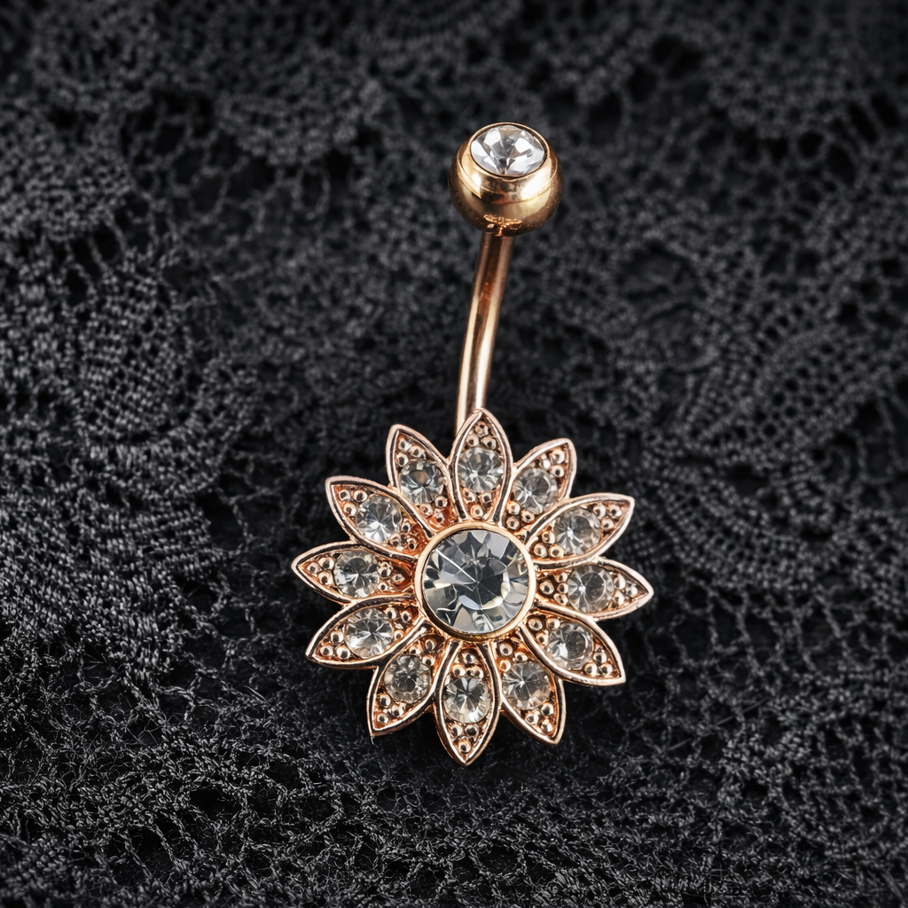Decorative belly button ring with floral design on a black lace background