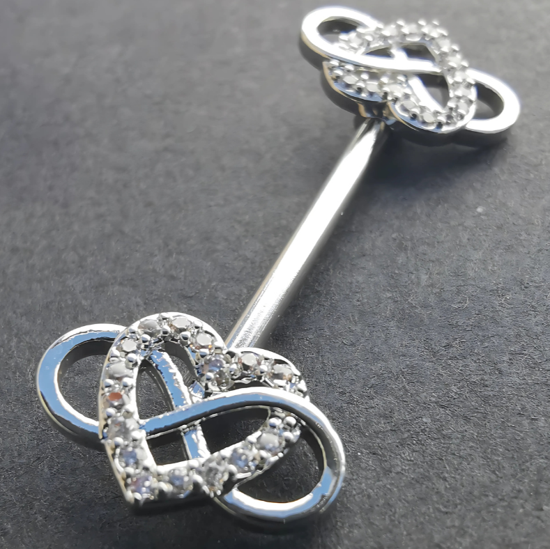 Pair of silver 14G surgical steel nipple bars featuring sparkling cubic zirconia gems, perfect for stylish body piercings.