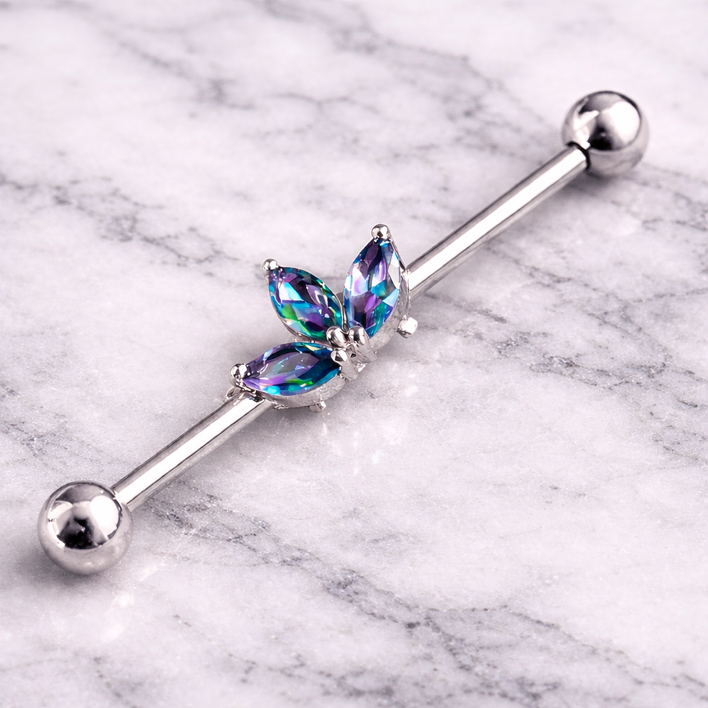 Insustrial earring with gemstones on a marble background
