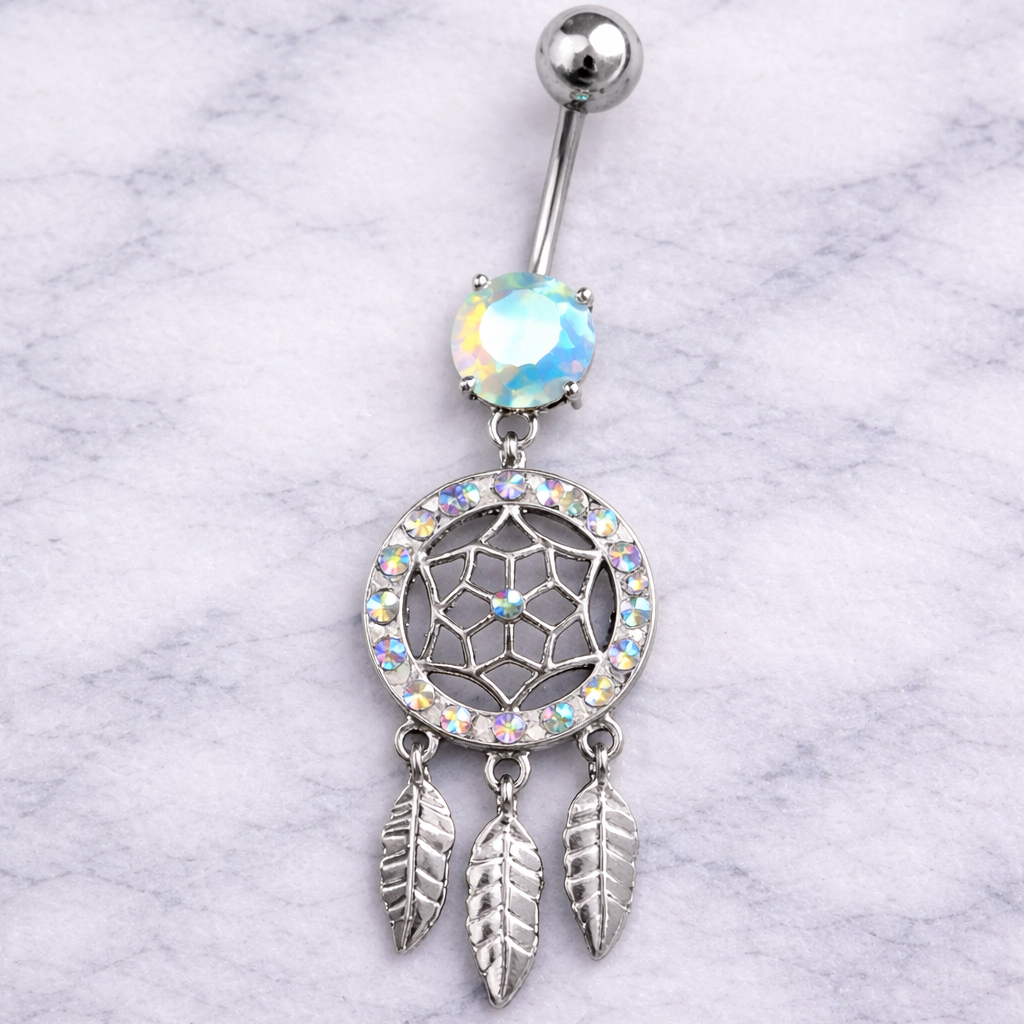 Belly button ring with dreamcatcher design on a marble background