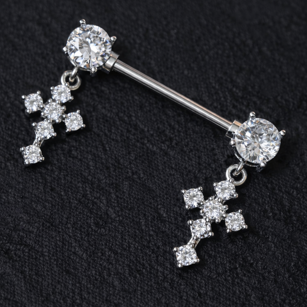Silver nipple bar with cross-shaped pendants on a black background