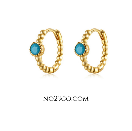Front view of turquoise zirconia tiny hoop ear piercing pair with 18k gold-plated sterling silver 925 finish showcasing a sleek design.