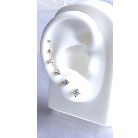 6 white stone stud earrings set from large to small on ear