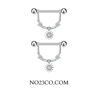Close-up of star dangle nipple bar detailing clear cubic zirconia and polished 316L steel finish.